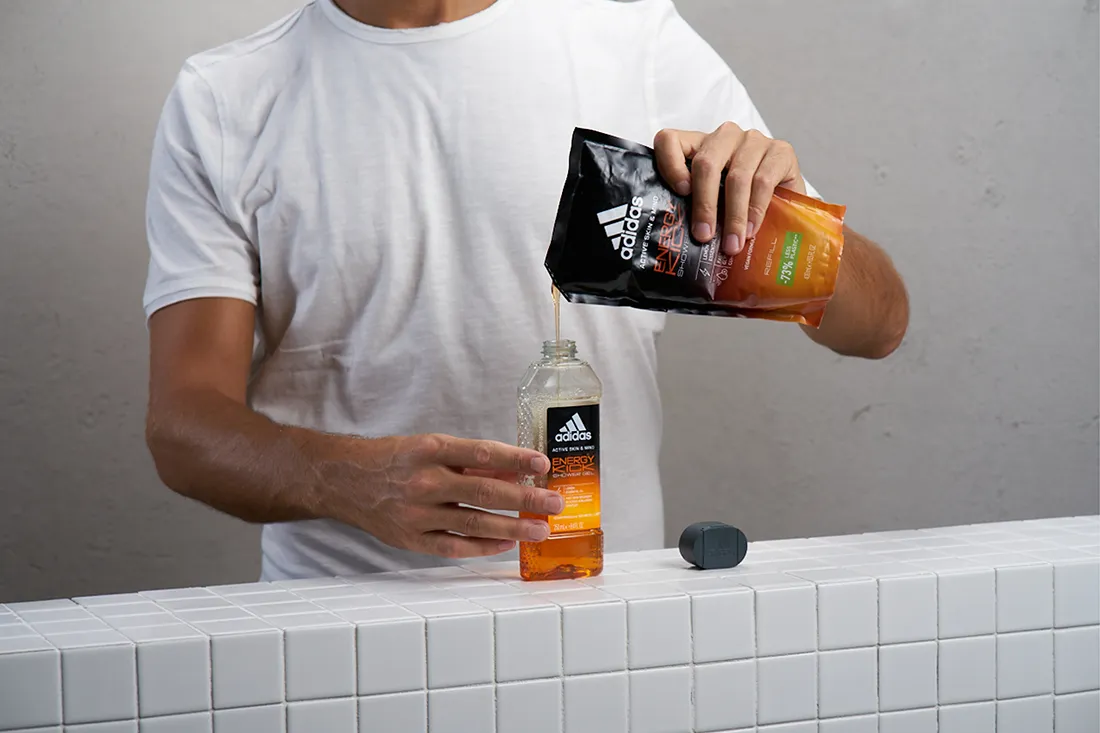 man with adidas energy kick orange